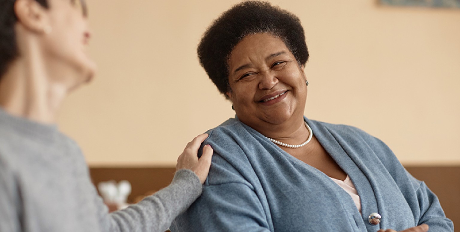 woman being supported by a friend