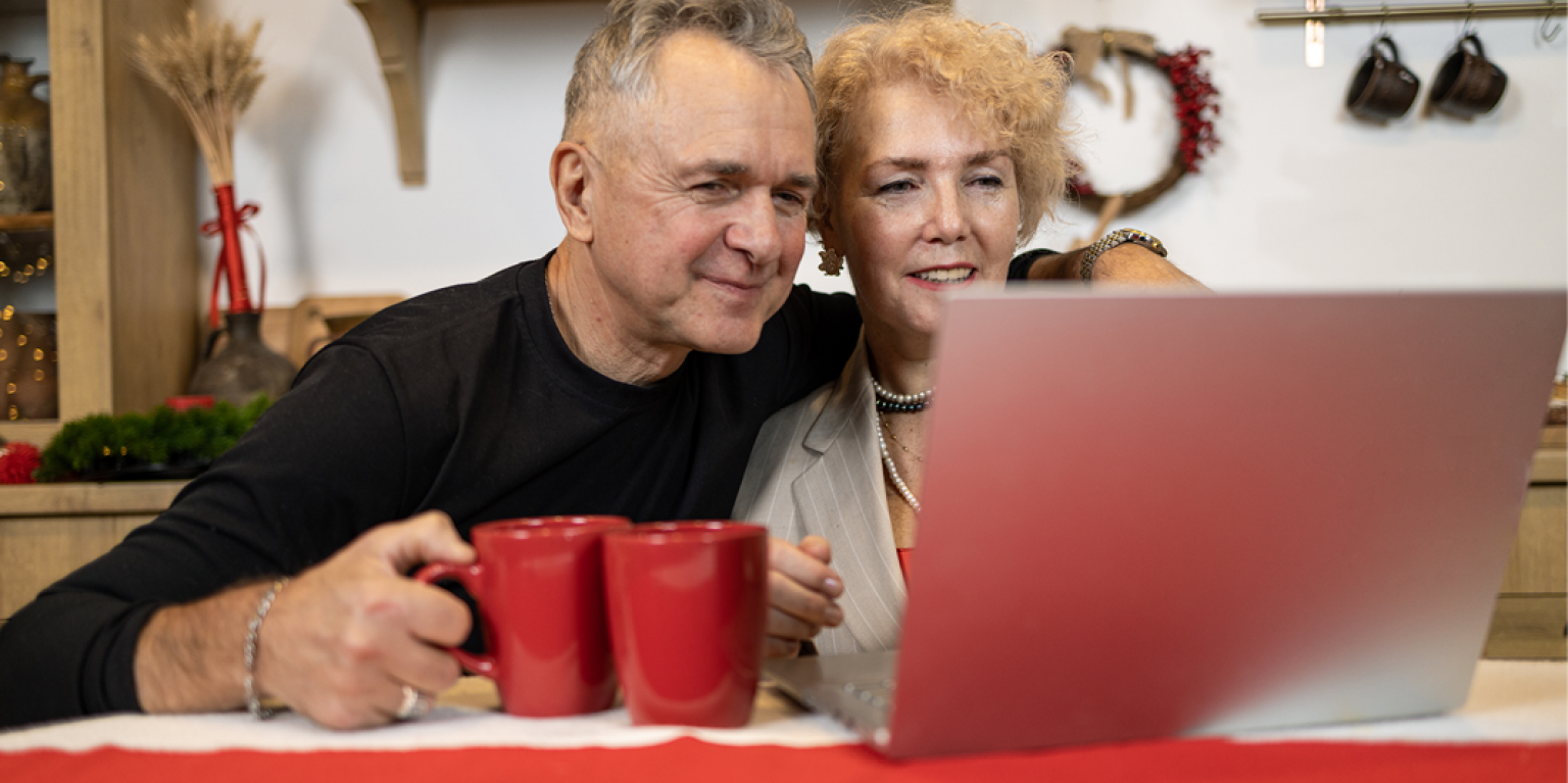 couple checking their kiwisaver account and writing a will with Public Trust