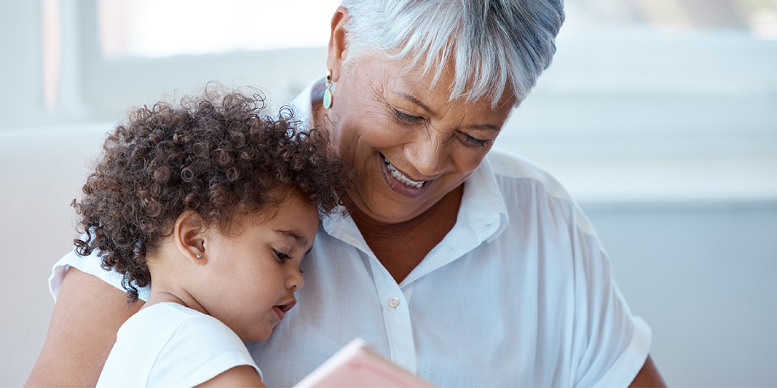 photo of grandmother with grandchild, embracing