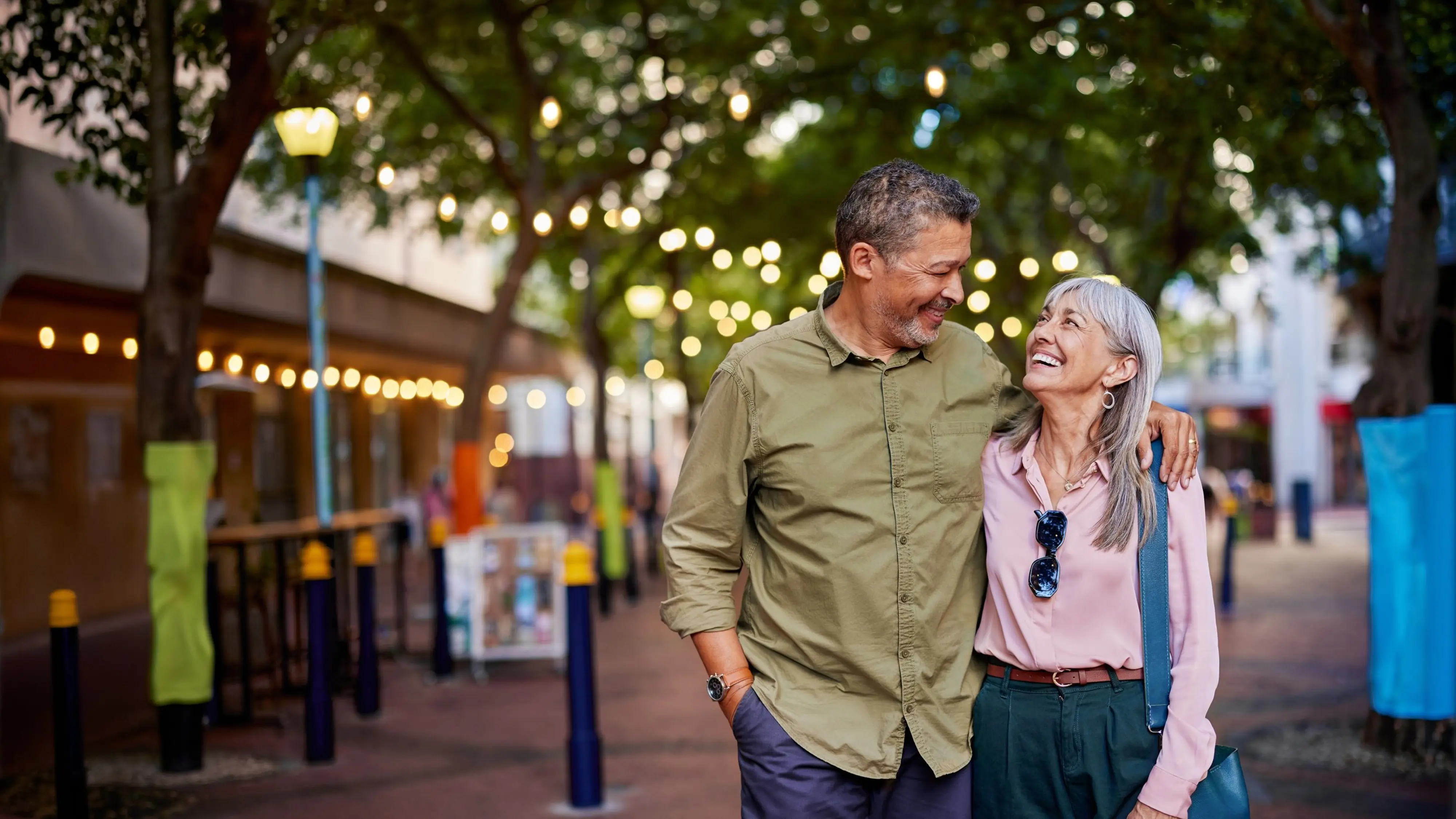 Public Trust Supergold customers walking down the street arm in arm smiling